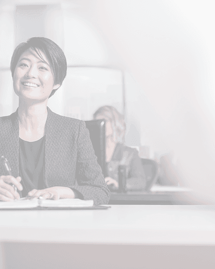 Executive taking notes during a leadership assessment