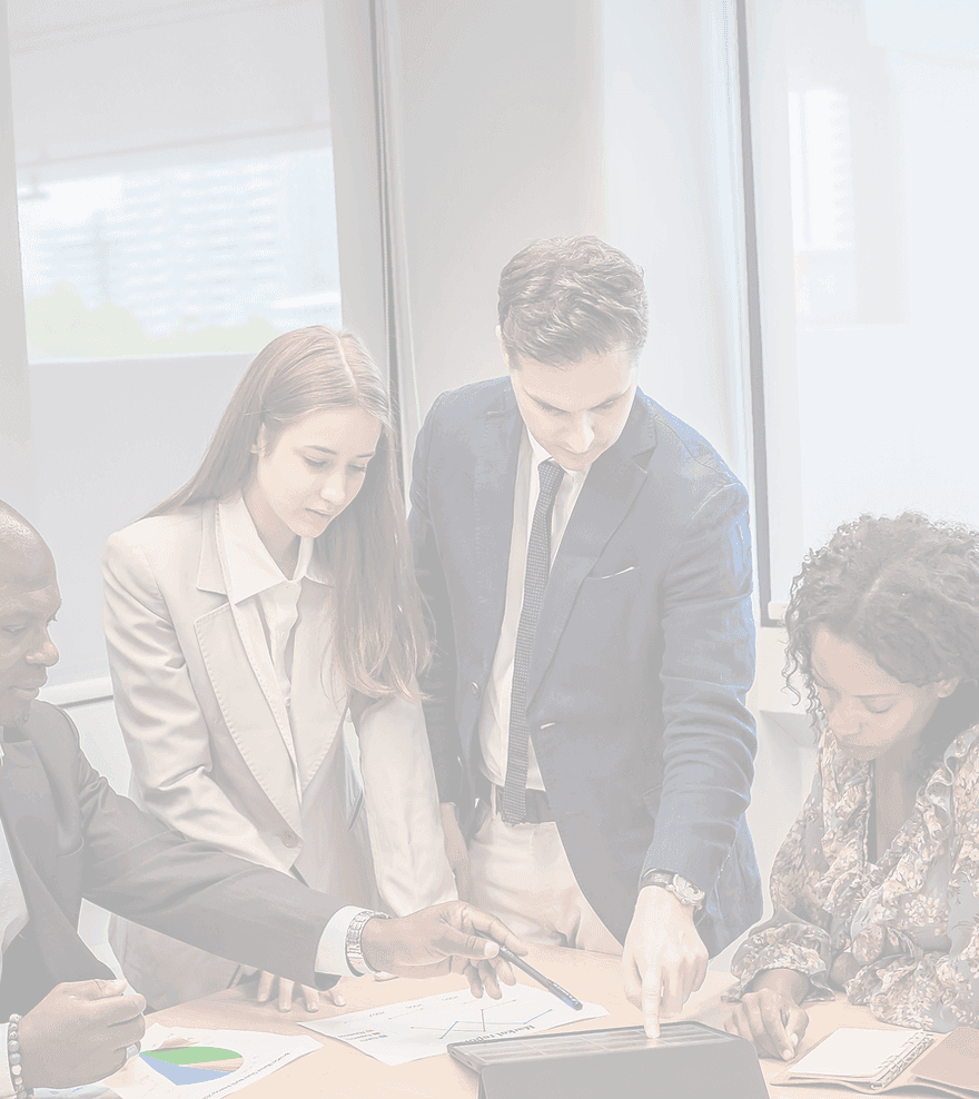 Colleagues gathered around a tablet in a meeting room