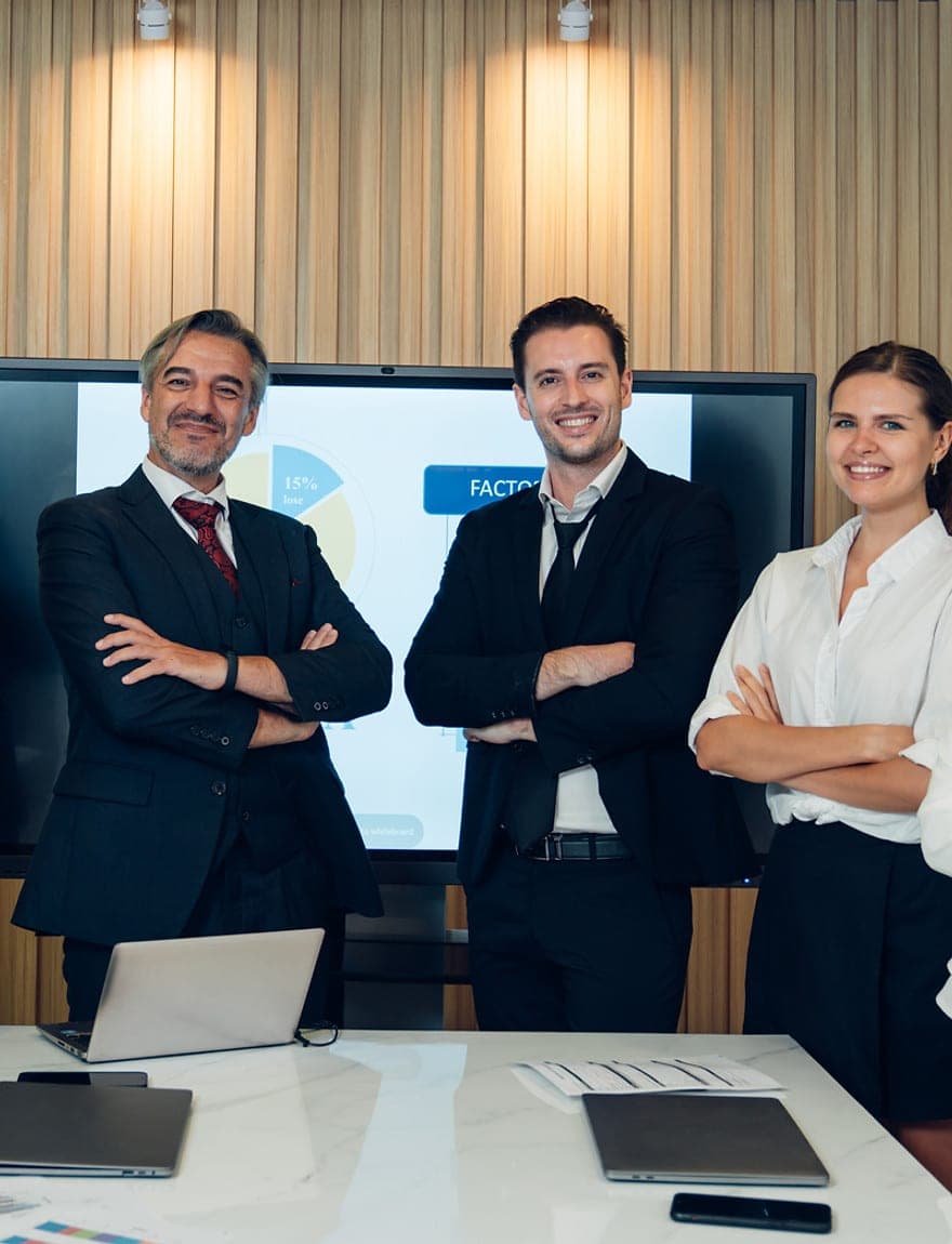 Colleagues in conversation across a boardroom table