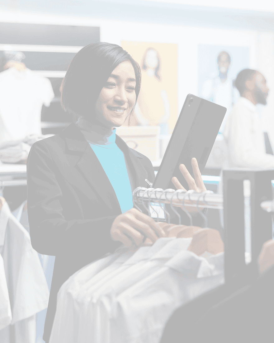 A retail leader reviewing stock with colleagues in the background